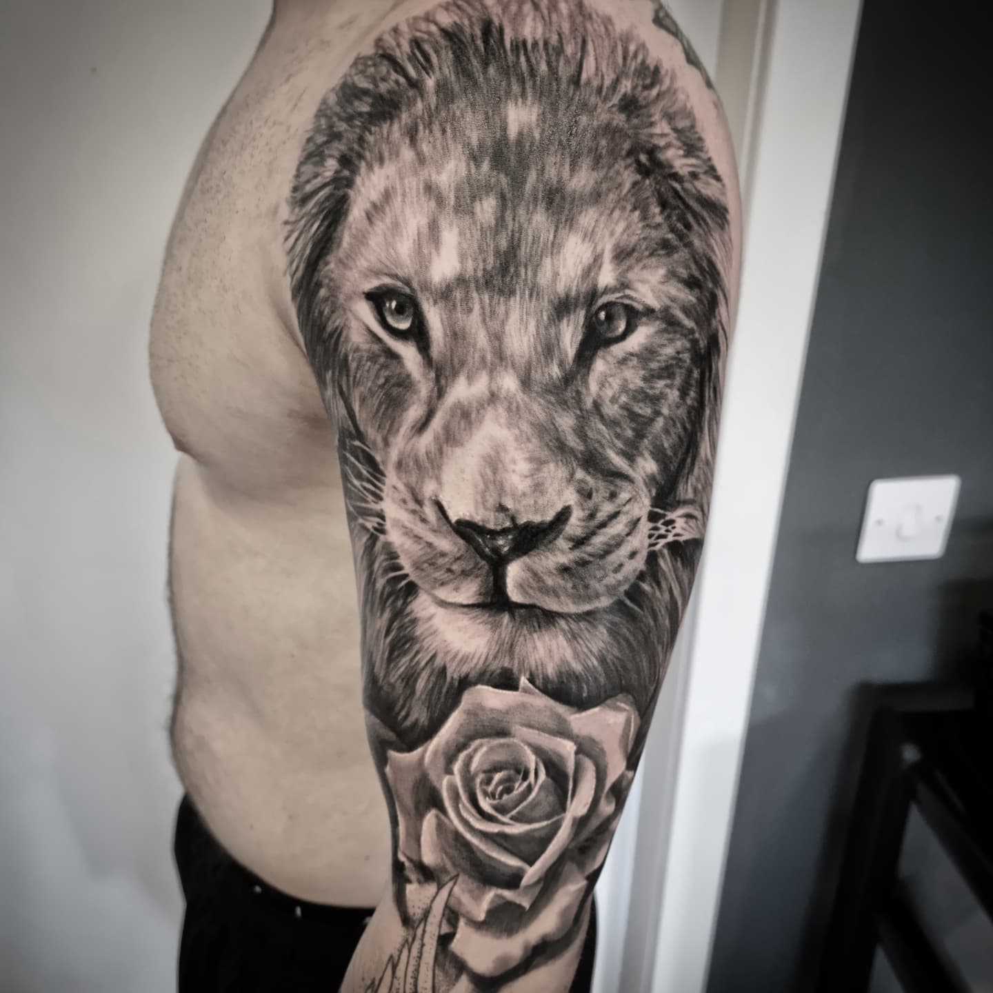 Realistic black and grey wildlife tattoo by Tomek Turlej at Studio XIII Gallery Edinburgh
