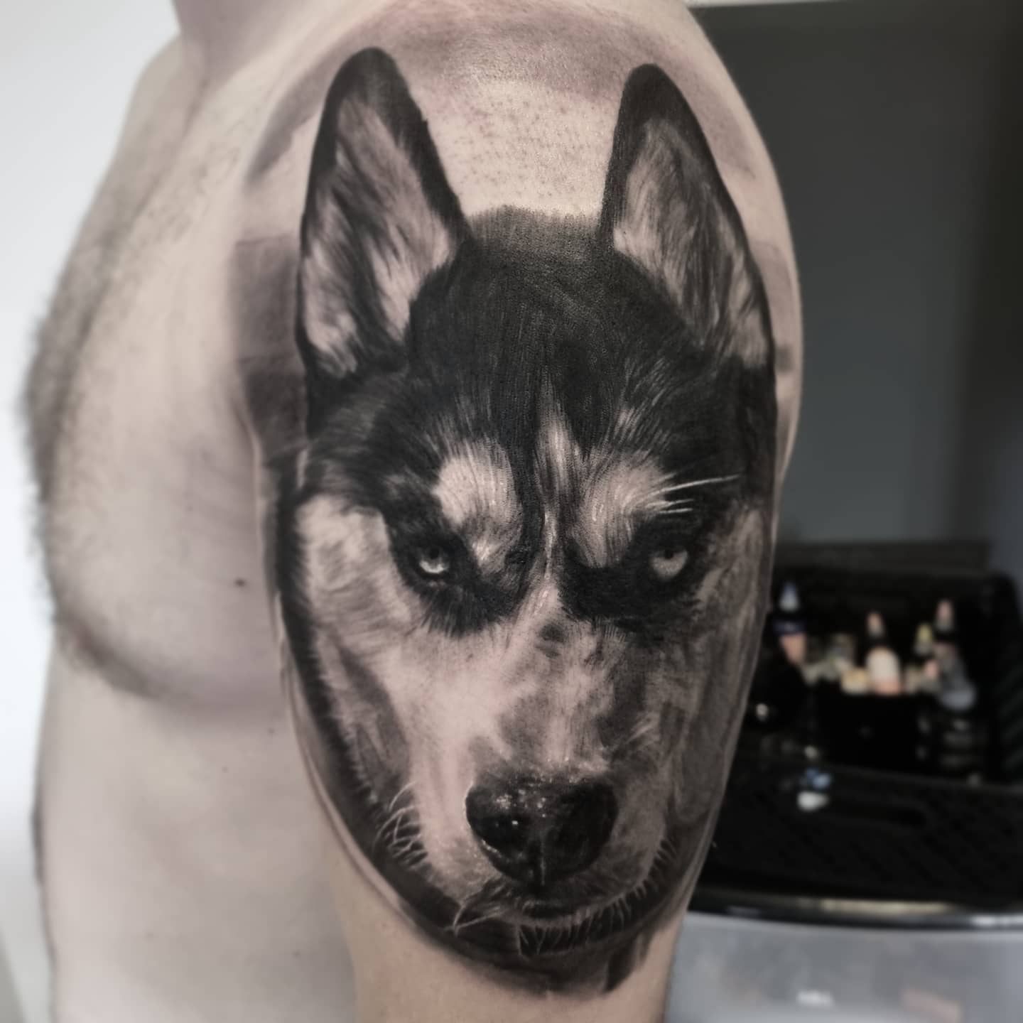 Photorealistic black and grey animal tattoo by Tomek Turlej, Studio XIII Gallery, Scotland
