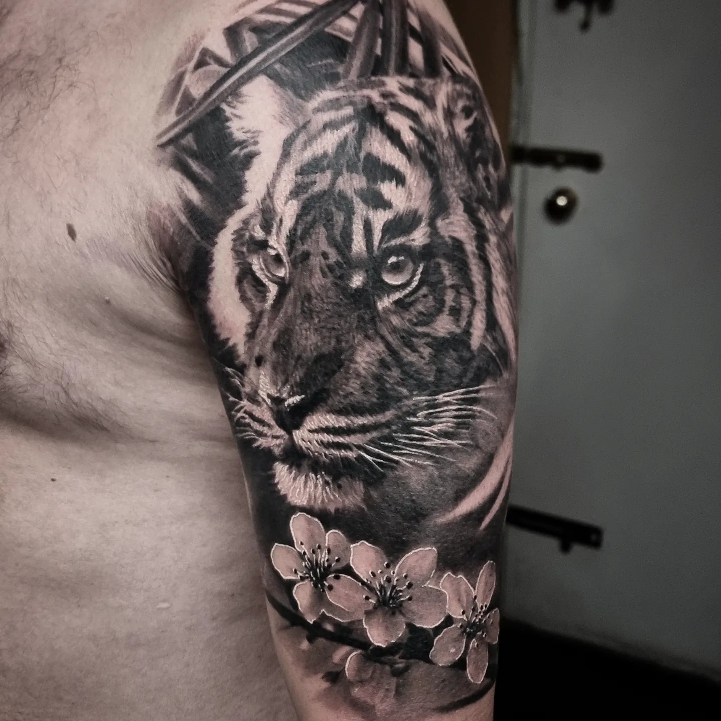 Black and grey realism portrait tattoo by Tomek Turlej, tattoo artist in Edinburgh