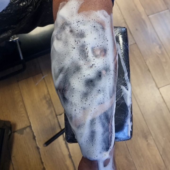 Custom black and grey realism tattoo by Tomek Turlej at Studio XIII Gallery Edinburgh